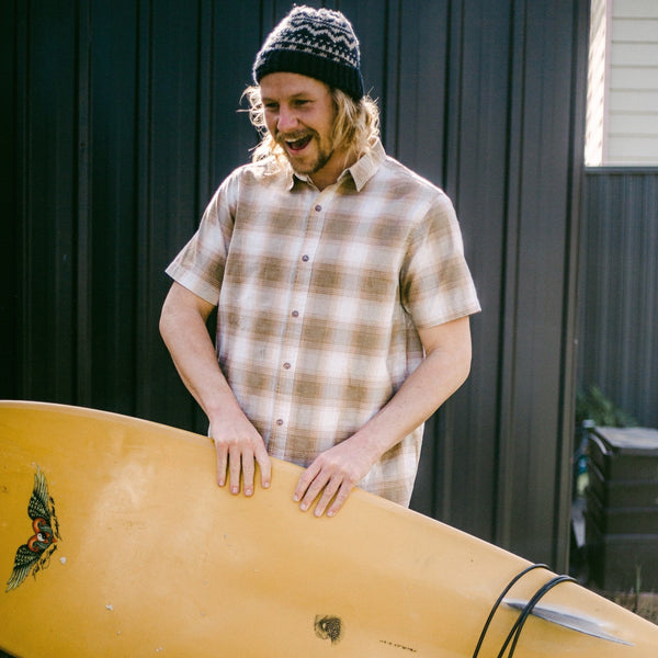 surfer in beanie and short sleeve shirt